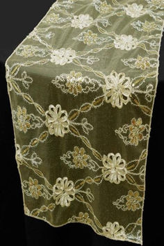 Elevate the ambiance of your next special occasion with the exquisite Champagne Lace Netting Fashionista Style Table Runner. This stunning table runner is the perfect way to add a touch of elegance and sophistication to any wedding, party, or formal event. Crafted with attention to detail, this table runner features clear lace netting adorned with satin florals and delicate sequins. Gold Table Runners, Lace Runner, Lace Table Runners, Burlap Lace, Fashionista Style, Lace Table, Beautiful Centerpieces, Style Table, Satin Flowers