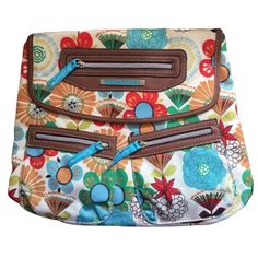 Beautiful, Multi-Colored, Floral Lily Bloom Purse. Made From 100% Recycled Karma Bloom Polyester With Vinyl Trim And A Magnetic Snap Closure. Versatile Strap Allows The Purse To Be Worn As A Shoulder Bag, As A Crossbody Bag, Or As A Backpack! Brand New With Tags And Never Used. Offers Are Welcome, And Discounts Are Given On Bundles! Follow Lynmau.Thrift On Instagram For Deals And Behind The Scenes! Keywords: Flowers, Boho, Everyday, Travel, Retro, Unique, Colorful, Cottagecore, Gardencore Retro Multicolor Bags With Zipper Pocket, Multicolor Travel Backpack With Removable Pouch, Travel Backpack With Removable Pouch, Multicolor, Travel Backpack With Removable Pouch In Multicolor, Multicolor Backpack With Removable Pouch For Everyday, Multicolor Backpack For Everyday Use, Colorful Cottagecore, Bloom Fashion, Convertible Purse