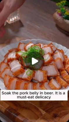 a plate full of food on top of a wooden table