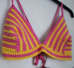 Embrace the sun-kissed vibes with this stunning Stripey Yellow and Pink Crochet Bikini Set. Handcrafted to perfection, this set features a delightful combination of colors that will make you the center of attention at the beach or by the pool. Made from a luxurious cotton-rich yarn, this bikini offers comfort and style, ensuring you're ready to soak up the sun in confidence. Product Details: 🌼 Colourful Design: The playful blend of yellow and pink stripes adds a pop of joyful energy to your bea Handmade Pink Swimwear For The Beach, Handmade Pink Swimwear For Vacation, Handmade Fitted Pink Swimwear, Pink Crochet Swimwear For Vacation, Yellow Bohemian Swimwear For Sunbathing, Skater Aesthetic, Colourful Design, Pink Crochet, Tropical Getaways