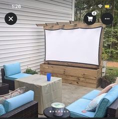 an outdoor movie screen is set up on the patio