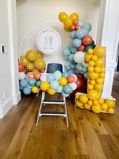 a room with balloons and chairs in it