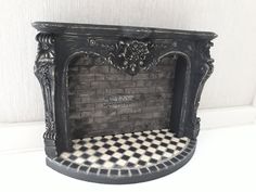 a black and white checkered floor next to a brick fireplace with an ornate mantle