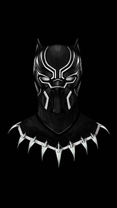 a black panther mask with spikes on it