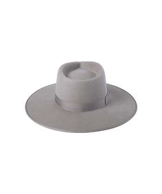 Inspired by vintage men’s styles, this hat is designed to make a statement. A stiffened wool fedora with rigid crown design. Trimmed on hat and rim with tonal gross grain ribbon. STONE GREY Rancher fedora hat Trimmed with tonal grey gross grain edged hat rim and bow ribbon detail 100% soft Australian wool Spot / specialist clean Brim measures 10 cm / 3.95” Classic crown height Rigid crown design Unisex style This hat is accredited with a UPF Rating 50+ (Australian Tested) Size + Fit: Rancher siz Flat Crown Fur Felt Fedora, Classic Gray Fedora With Curved Brim, Classic Gray Fedora Hat, Classic Gray Flat Brim Hat, Classic Gray Hat Bands With Flat Brim, Classic Gray Wide Brim Fedora, Classic Gray Flat Brim Hat Band, Classic Gray Fedora For Fall, Classic Gray Wide Brim Felt Hat