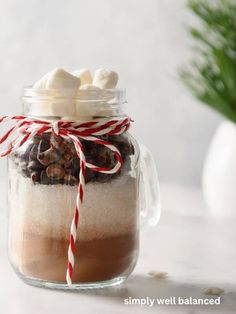 a jar filled with hot chocolate and marshmallows