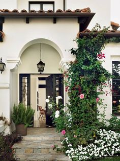 an image of a house with flowers and plants on the front door, which reads luxury trend