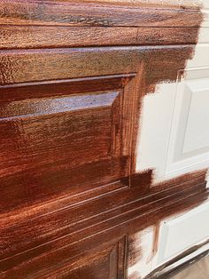 a close up of a wooden door with paint on the top and bottom part of it