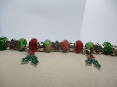 #3163 Handmade, Large Beaded Stainless Steel Holly Christmas Bracelet... 7-9".. $38 .. This item and items for the entire family can be found at my website www.charmedbycharmsbycindy.com Stop over and visit and see all my amazing items that I have for sale.. Thanks !!! Holly Christmas, Christmas Holly, Stainless Steel