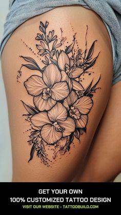 a woman's thigh with flowers on it and the words get your own custom tattoo design