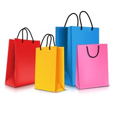 three colored shopping bags with black handles on white background photo - shopper / getty images