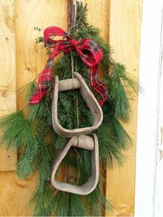 a wreath hanging on the side of a wooden door