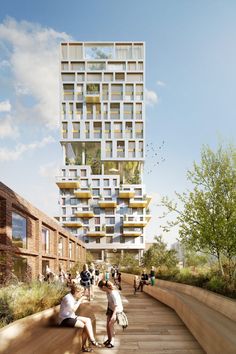 people are sitting on the steps in front of a tall building