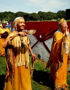 two native american women standing next to each other