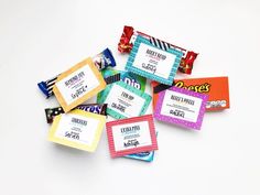 candy bars with labels on them sitting next to each other in front of a white background