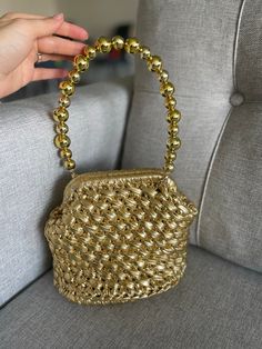 ✨Leather top handle bag knitted with metallic yarn. ✨Woven Leather bag has lined. ✨Luxury metallic bag strap has quality materials. ✨Metallic leather bag can be used as a shoulder bag. ✨Custom top handle bag is prepared in the color options do you want. ✨These handmade metallic leather handbag can accompany your combinations in many ways. Evening bag, wedding bag, make up bag. 🎁Crochet metallic bag can be perfect gift your mothers as a mothers day gift.  ✨Indulge in luxury with our exquisite co Gold Crochet Tote Bag With Braided Handles, Gold Woven Crochet Shoulder Bag, Handmade Gold Crochet Shoulder Bag, Elegant Crochet Bag With Gold-tone Hardware, Leather Crochet, Metallic Leather Bag, Hand Knit Bag, Leather Bag Handmade, Luxury Crochet Bag With Gold-tone Hardware