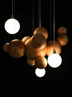 a bunch of lights that are hanging in the dark