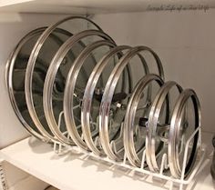 a bunch of rims that are on a shelf