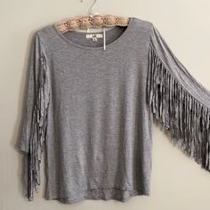 Nwot Ya Los Angeles Sz Med Bought At A Mountain Boutique In Beautiful Nccotton/Rayon 3/4 Sleeves With Fringe. This Top Is Adorable!! Western Look! Fun!! Wear With Blue Jeans And Boots! Wear With A Vest! Just Wear It For A Fun Day Out!!! Spring Cotton Tops With Fringe, Long Sleeve Fringe Tops For Summer, Cotton Fringe Tops For Spring, Casual Long Sleeve Top With Fringe, Gray 3/4 Sleeve Tops For Fall, Gray Summer Top With 3/4 Sleeves, Gray 3/4 Sleeve Top For Summer, Gray Half Sleeve Tops For Spring, Gray 3/4 Sleeve Summer Top