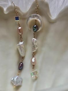 Multicolored multi-shape freshwater baroque pearl earring. Moon and star earrings. Crystal dangle Bridal earrings. Space sparkle earrings. This unbalanced pair of unique and chic dangle earrings are made with beautiful baroque multi shapes multicolored freshwater pearls and swarovski crystal beads. They are perfect for bridal earrings or daily wear. And suitable for daily occasions. They are perfect for wedding occasion or any special occasions.  These earrings make for an elegant addition to an Bead Earring Ideas, Bead Earrings Ideas, Ethereal Earrings, Earrings Space, Whimsical Earrings, Dangle Pearl Earrings, Unique Drop Earrings, Unique Bridal Jewelry, Whimsical Jewelry