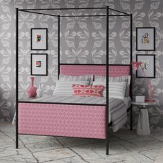 a pink and grey bedroom with four poster bed