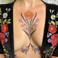 a woman's chest with flowers on it