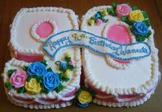 two birthday cakes decorated with flowers and ribbons