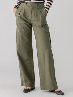 DETAILS High Rise Wide Leg Cargo Trouser Pleated Front and D-Ring Detail Hook Bar and Zip Fly Closure Relaxed Fit SIZE + FIT Model is 5'9 and is wearing a size S. Waist: 30" Front Rise: 12" Inseam: 33" Leg Opening: 23" FABRIC + CARE 98% Cotton 2% Spandex Twill Machine Wash Cold, Tumble Dry Low Imported BETTER COTTON MEMBERS By choosing our cotton products, you support our investment in Better Cotton's mission. This product is sourced via a mass balance system and therefore may not contain Better High Rise Pants, Shopping Day, Cargo Trousers, D Ring, Fabric Care, Investment, Fitness Models, Wide Leg, High Rise