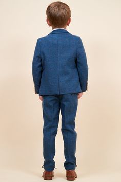 The perfect accompaniment to the men's Dion suit, this adorable children's version will stand out for sure. It has been created with meticulous craftsmanship using a herringbone weave, just like the men's but a mini replica. With handy adjuster straps in the trousers for the perfect fit, this heritage three piece may just steal the show. Model wears size 6 yrs. Features Herringbone Single-breasted Notch lapel Double back vent Three button cuff Single button blazer fastening Complimentary pocket Blue Tweed Suit For Work, Blue Tweed Suits For Work, Classic Blue Tweed Suit, Blue Tweed Suit With Notch Lapel, Blue Tweed Suits With Notch Lapel, Fitted Blue Tweed Suits, Blue Tweed Suits, English Gentleman, Blue Tweed