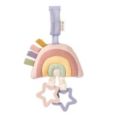 a toy with a rainbow and stars hanging from it's side on a white background