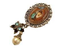 Nostalgic, unique brooch in a classy antique design. The brooch is made of antique silver-colored metal and a hand-crafted glass cabochon that shows a beautiful motif with an Art Nouveau lady and butterflies. A pendant with a shell pearl and a butterfly charm, decorated with high-quality rhinestones, are attached to the bottom of the brooch. The brooch, including the pendant, measures 6.4 L x 2.9 W cm. Art Nouveau Cabochon Brooches As Gifts, Antique Silver Vintage Brooches As Gift, Victorian Antique Silver Brooch For Gift, Victorian Antique Silver Brooches As Gift, Victorian Antique Silver Brooch, Cabochon Brooches As A Gift, Victorian Style Brooches For Gift, Art Nouveau Lady, Unique Brooch