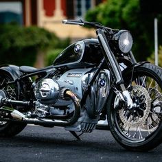 a black motorcycle parked on the side of a road