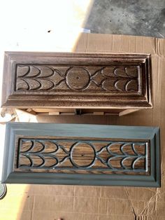 two wooden boxes sitting on top of cardboard