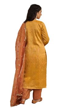 Warm yellow plain kurta. Paired with a pant. Comes along with a rust dupatta with hand embroidery and kiran lace border. - Aza Fashions Semi-stitched Tussar Silk Sets For Diwali, Sheer Dupatta Set For Puja And Eid, Sheer Dupatta Sets For Puja On Eid, Sheer Dupatta Sets For Puja During Eid, Sheer Dupatta Set For Eid Puja, Eid Puja Set With Sheer Dupatta, Diwali Puja Set With Sheer Dupatta, Tussar Silk Straight Kurta Sets For Festivals, Festival Tussar Silk Straight Kurta Sets