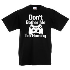 "Step into game mode with our extraordinary Gaming T Shirt. This head-turning gamer tee has been specifically crafted for those passionate young gamers who know that real Dont Bother Me Im Gaming! 🎮💥  This isn't just your average shirt; it's a statement, a lifestyle. Designed with vibrant graphics, it's the perfect top for any screen warrior. An absolute must-have for every kid's gaming top collection  Crafted with exceptional quality, the shirt is made from soft, smooth and exceptionally durable DTF ink. This ensures that your tee not only feels amazing on the skin but also offers superior longevity, maintaining the perfect balance between comfort and durability. Stand out in the crowd with our unique and trendy gaming Tshirt.🛡️🔝  Beyond just looking good, this shirt is also breathabl Black Gamer T-shirt With Letter Print, Black Short Sleeve Gamer Tops, Black Gamer Top With Funny Text, Black Gaming Tops With Graphic Design, Black Gamer T-shirt With Funny Text, Gamer Style Short Sleeve Tops With Funny Text, Black Gamer Tops With Logo Print, Gamer Tops With Letter Print, Black Cotton T-shirt For Gaming Events