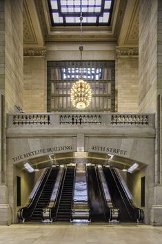 an escalator in the middle of a large building