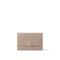 LOUIS VUITTON® - Capucines Compact Wallet - Galet Louis Vuitton Capucines, Compact Wallet, Louis Vuitton Official, The Grey, Press Studs, Small Leather Goods, Leather Goods, Credit Cards, Cowhide Leather