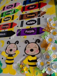 some crayon stickers are laying on top of a paper with flowers and bees