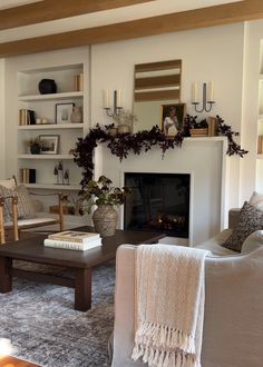 a living room filled with furniture and a fire place