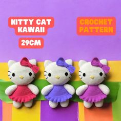 two hello kitty dolls sitting on top of a purple and yellow striped background with the caption kitty cat kawaii 209cm