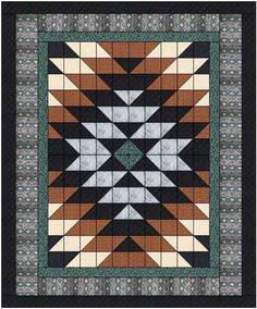 a black and brown quilt with an intricate design