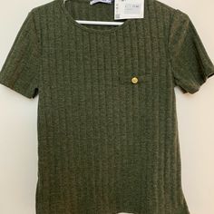 Dark Olive Green Shirt In Perfect Condition Has Never Been Worn And Still Has Tags Attached. Size Large But Has A Slim Fit So If You Are A True Size Medium It Will Fit Perfectly. Green Short Sleeve T-shirt For Work, Green Short Sleeve Top For Work, Zara Casual Fall T-shirt, Trendy Green Short Sleeve Knit Top, Zara Casual Tops For Workwear, Zara Trendy Short Sleeve Shirt, Trendy Zara Short Sleeve Shirt, Zara Crew Neck Top For Work, Trendy Zara Crew Neck Knit Top