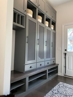 a large gray cabinet sitting next to a white door