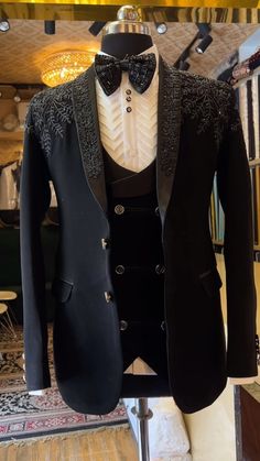 a tuxedo jacket and bow tie on display