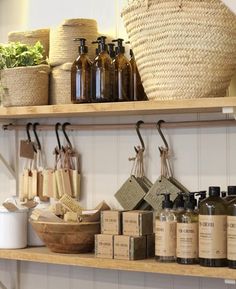 the shelves are filled with different types of soaps and lotion bottles on them