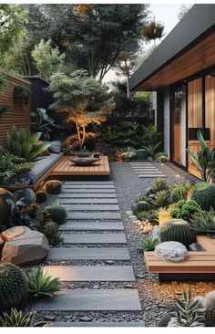 a very nice looking garden with lots of plants and rocks in it's center