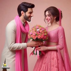 a man and woman dressed in pink posing for a photo with flowers on their wedding day