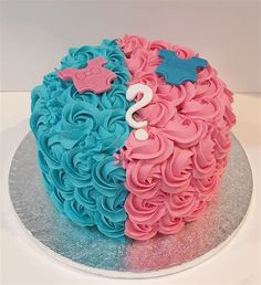 a blue and pink cake on a silver plate