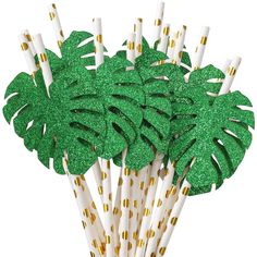 green and gold party straws with palm leaves