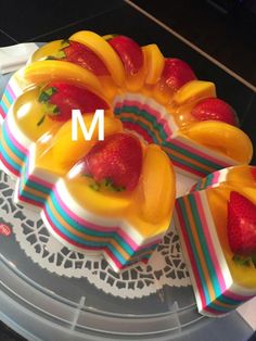 there is a cake with fruit on it and the words martha written in white letters